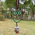 Close-up detail of a handmade owl pendant with colorful crystal beads and copper wire wrap. - Green Aventurine