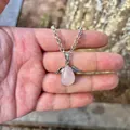 Detail of a natural rose quartz teardrop angel pendant with silver wings on a necklace - Pendant Only (No Chain) / Rose Quartz