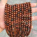 Detailed view of natural round dragon blood stone loose beads for DIY jewelry making - Mahogany Obsidian