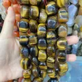 Nahaufnahme von polierten Tigerauge-Natursteinperlen 15x20mm für DIY-Schmuckherstellung - Tigerauge