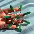 Close-up detail of a star-shaped natural green stone crystal healing pendulum ornament - Aventurine Jade
