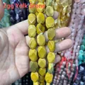 Macro dettagliata di perle sfaccettate in pietra giallo uovo per accessori gioielli fai da te - Diaspro Giallo