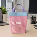 Portable pink mesh cosmetic bag with blue trim and purple handles for travel storage - Pink