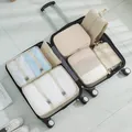 Premium beige 7-piece travel packing cube set neatly organized inside an open suitcase - 7-Piece Set / Beige
