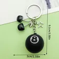 Black 8-ball and cherry keychain charm with dimensions 9.1cm by 3cm, ideal bag decor - Black Cherry Black Star Style (ER1624)