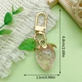 Cute pink resin strawberry keychain with golden clasp and detailed size measurements - Translucent Light Pink Strawberry Pendant Style (ER937)
