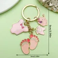 Cute baby-themed pink oil-dripping alloy keychain with charms - Pink Bow Elephant Clothes Feet Style (ER1521)