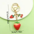 Kawaii fruit keychain featuring 3D strawberry and cherry charms with gold plating finish - Strawberry Cherry Style (ER1871) / 3x9.1cm