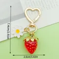 Strawberry keychain with daisy charm and heart-shaped clasp in a vibrant red finish - Colorful Transparent Strawberry Style (LS618)