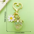 Close-up view of a translucent resin strawberry keychain with daisy charm and dimensions - Iridescent Translucent Strawberry Style (LS407)