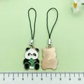 Cute enamel panda metal phone charms with bamboo design shown next to a ruler for scale - Chinese Style Hugging Bamboo Shoots Panda (ER975)
