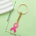 Detalle del llavero con lazo rosa con dimensiones de 8,4 cm por 3 cm de ancho - LS511 / Dorado