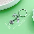 Llavero vintage de plata con árbol de la vida, búho y luna sobre fondo verde claro - Estilo Búho Estrella Luna Árbol de la Vida (ER554)