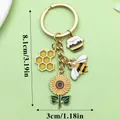 Gold-plated bee and sunflower charm keychain with honeycomb and honey pot detail - Sunflower Bee Honey (ER788) / Yellow
