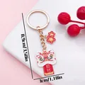 Close-up of traditional Chinese lion dance keychain with dimensions 8.9cm by 3.0cm - Wealth Attraction Lion Dance (ER2151) / 3x8.9cm / Red
