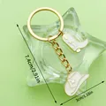 Western white enamel cowboy hat and boot keychain with golden star charms, 7.4cm long - White Enamel Boot Hat (ER1262)