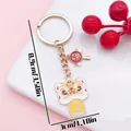 Traditional Chinese lion dance keychain in gold finish with blessing charms - Chinese Knot Blessing Lion Dance (ER2153) / 3x8.9cm / Yellow