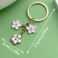 Elegant sweet metal sakura flower keychain pendant for bag decoration with precise measurements - White Flower (ER569) / White