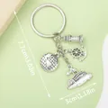 Nautical silver keychain accessory featuring globe, lighthouse, anchor and wheel charms - Nautical Cruise Helm Globe (ER386) / Antique Silver