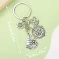 Nautical themed metal keychain with sailboat, anchor, and compass charms, 8.6cm length - Nautical Sailing Helm Compass (ER385) / Antique Silver