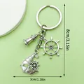 Antique silver nautical keychain featuring lighthouse sailboat and ship wheel charms 8cm - Lighthouse Sailboat Rudder Style (LS436) / Antique Silver
