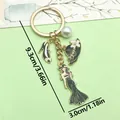 Llavero elegante de aleación con dijes de vestido de gala, tacón y sombrero negro. - Estilo de Modelo de Vestido Negro (ER906)