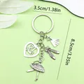 Silver ballet dancer keychain with shoe and dress charms, dimensions 3.5x8.5cm - Ballet Girl Shoes Skirt & Heart Style (ER550)