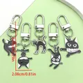 Porte-clés uniques en émail chat noir avec couteau en cinq poses pour sacs Halloween - Chat Noir avec Couteau (ER761) / 5 Pièces