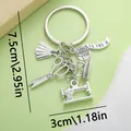 Creative silver sewing machine scissors and dress keychain accessory with size markers - Sewing Machine Scissors Tape Measure Iron Dress (ER344)