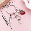 Detailed size view of medical keychain with anatomical heart and stethoscope charms - Syringe Red Heart (ER2163)