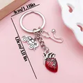 Close-up of medical keychain charms with size measurements showing 7.8cm total length - Stethoscope Red Heart Ambulance (ER2160) / Antique Silver
