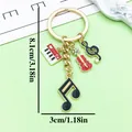 Vintage alloy musical note keychain with piano and violin charms, 8.1cm in length - Piano Violin Style (ER2199) / Red