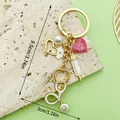 Detail view of medical nurse keychain with stethoscope, syringe charms and size specs - Pearl Nurse Hat Stethoscope Syringe Heart Keychain (LS638) / Gold
