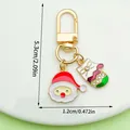 Niedlicher Weihnachts-Schlüsselanhänger mit Weihnachtsmann und Handschuh, 5,3x1,2 cm - Weihnachtsmann Handschuhe (LS503)