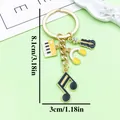 Music theme alloy keychain with musical note and guitar charms, size 8.1cm x 3.0cm - Yellow Piano Guitar Headphone Note Style (ER2202)