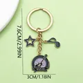 Detailed product view of music theme keychain with guitar and star charms measuring 7.6cm - Purple Guitar Star Note (LS662)