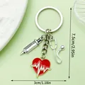 Medical themed keychain with red heart, syringe and stethoscope charms, 7.5cm size - Syringe Stethoscope Heart Keychain (LS589)