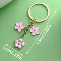 Dimension detail of a sweet pink enamel cherry blossom metal keychain bag charm - Pink Flower (ER567) / Pink