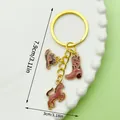 Western cowboy keychain featuring enamel hat, boot and horse charms on golden ring. - Brown Enamel Hat Boot & Pony (ER1267)