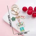 Gold-plated traditional Chinese lion dance keychain with lucky charms for bags - Health Clover Lion Dance (ER2144) / 3x8.8cm / Green