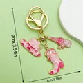 Detailed view of pink cowgirl hat and boot charms keychain with size dimensions markings - Pink Enamel Boot Hat (ER1258)