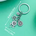 Silver alloy floral keychain with sunflower and daisy charms and product dimensions - Antique Silver Flower (ER549)