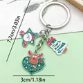 Festive Christmas keychain with Santa Claus, tree and reindeer charms in silver metal finish - Christmas Heart, Reindeer, Santa & Christmas Tree (ER829)