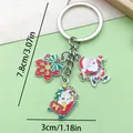 Christmas themed keychain with Santa Claus snowman and snowflake charms 3cm width - Christmas Lights, Skiing Santa, Reindeer & Snowflakes (ER830)