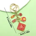 Llavero dorado de estilo chino con colgantes de la suerte rojos - Riqueza y Linterna de Fortuna (ER893)