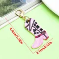 Detailed pink cowboy boot keychain charm featuring cow spots pattern and gold clasp - Cow Print with Red Belt Cowboy Boot Lobster Clasp Pendant (ER2296) / 2.1x4.4cm (2.1g) / Purple