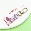 Western style cowboy boot keychain charm with pink hearts, measuring 6.2cm by 2.1cm. - Western Cowboy Boot Style (ER2277) / 2.1x6.2cm (4.4g) / Purple Pink
