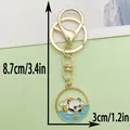 Schattige cartoon panda metalen sleutelhanger met elegante goudkleurige afwerking - Zwemband Panda (ER1071)