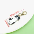 Detailed black and white enamel cat charm with lobster clasp dimensions 4.2cm x 1.3cm - Black And White Enamel Cat (ER2310)