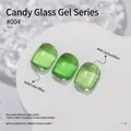Translucent candy green nail gel polish featuring glass shine and cat-eye glitter effect - No.04